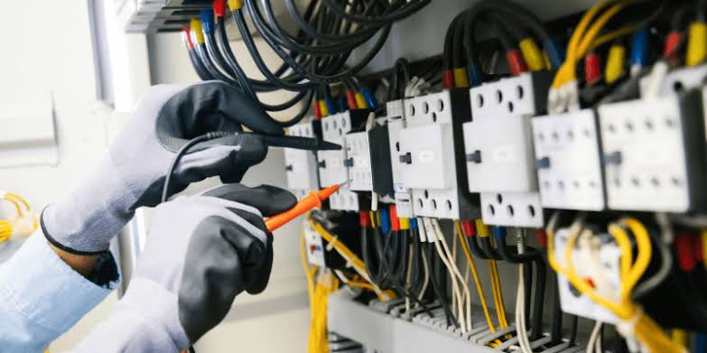 Marine commissioning engineer working at control panel